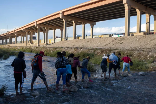 Juarez, Mexico, 11-15-2022: Migrants from Venezuela cross the Rio Grande to surrender to the border patrol with the intention of requesting asylum in the United States.