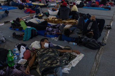 Juarez, Mexico, 05-01-2023 : Migrants who traveled in a caravan rest in a gym in the city of Jimnez Chihuahua before continuing their journey to the border to request asylum.