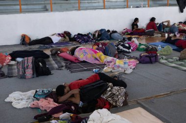 Juarez, Mexico, 05-01-2023 : Migrants who traveled in a caravan rest in a gym in the city of Jimnez Chihuahua before continuing their journey to the border to request asylum.