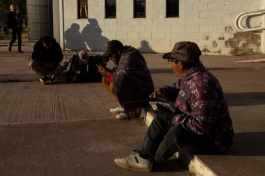 Juarez, Mexico, 11-28-2022: Migrants mostly from Ecuador and Bolivia travel in trucks towards the border between Mexico and the United States with the intention of requesting humanitarian asylum.