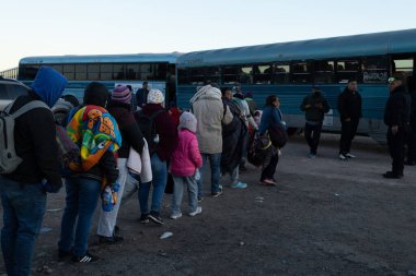 Juarez, Mexico, 11-28-2022: Migrants mostly from Ecuador and Bolivia travel in trucks towards the border between Mexico and the United States with the intention of requesting humanitarian asylum.