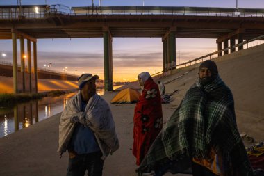 Juarez, Mexico, 12-21-2022: Migrants of different nationalities awaiting the end of title 42 camp on the Rio Grande, the national border between Mexico and the United States.
