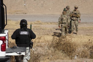 Juarez, Mexico, 12-21-2022: Texan National Guard places wire and barbed wire on the banks of the Rio Grande to prevent migrants from crossing into the United States to request humanitarian asylum.