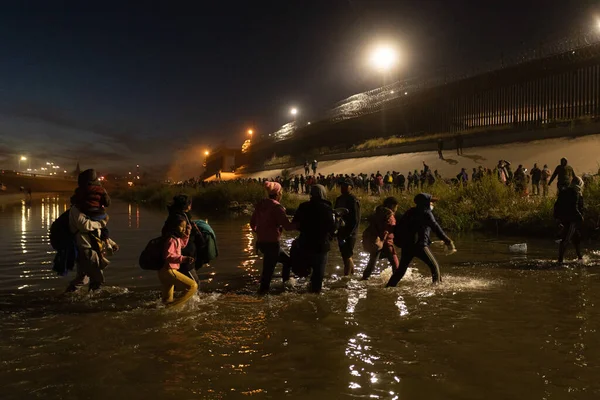Juarez, Mexico, 12-11-2022: 1400 migrants, mostly from Bolivia and Nicaragua, cross the border in a caravan in Juarez to surrender to the border patrol to request humanitarian asylum.