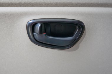 close-up door handle with car lock inside.