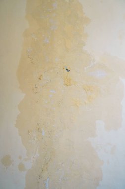 Water seeps into the walls of leaking pipes, causing water stains and peeling paint. clipart