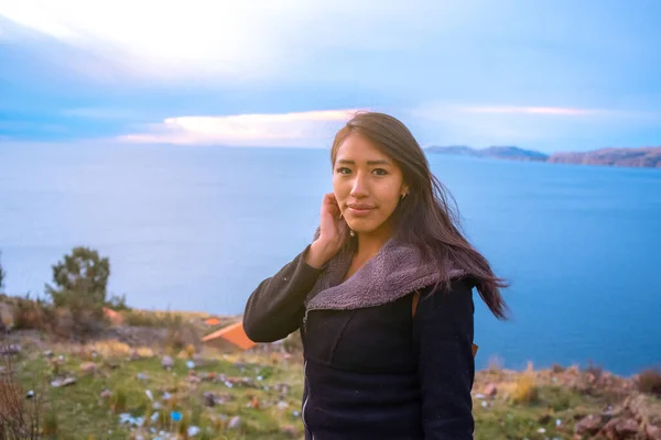 relaxed brunette latin woman on lake titicaca