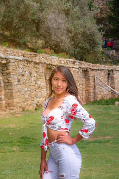 horizontal photo of young latin woman smiling tourist on isla de