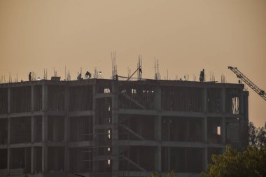 Erection of reinforced concrete building with cast-in-place technology, Construction Site, Polluted growth 