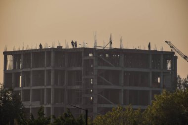 Erection of reinforced concrete building with cast-in-place technology, Construction Site, Polluted growth 