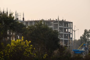Erection of reinforced concrete building with cast-in-place technology, Construction Site, Polluted growth 