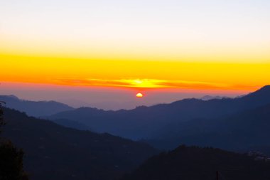 The last sunset photograph, mountain peaks view Sunset golden hour photography background in Uttarakhand 