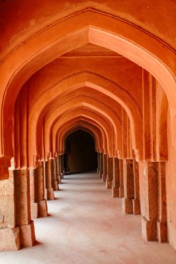 Stepwall for water conservation in ancient times in Near Qutub Minar Mehroli Park New Delhi, India clipart