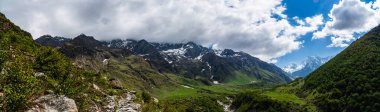 Snow Capped Nanda Devi and Valley of Flowers National Parks Panorama Photography  clipart