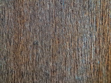 Tasarım ve dekorasyon için ahşap doku. Koyu kahverengi ve kalın çizgileri var. Pürüzsüz doku, desen. Doğal ahşap arkaplan