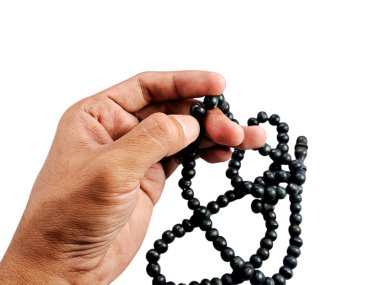 hand holding a set of prayer beads, symbolizing spirituality and reflection. Perfect for religious themes, spiritual concepts clipart