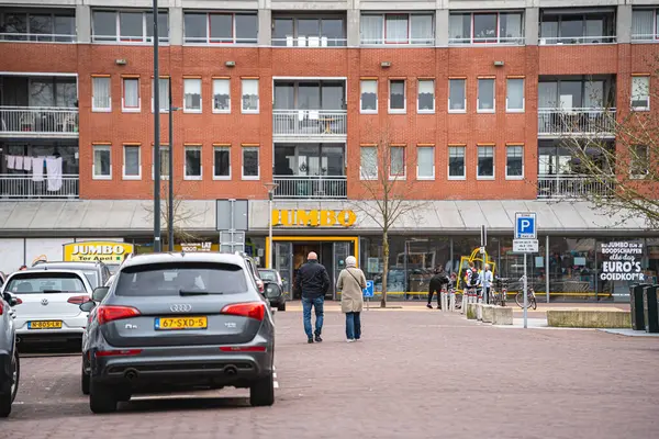 stock image Ter Apel, the Netherlands - March 30, 2024: Parking Spots at Shopping Center Ter Apel with Jumbo Supermarket