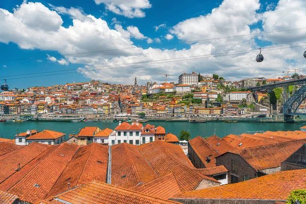 stock image Porto, Portugal old town skyline from Gaia city on Douro river with orange rooftops and Dom Luis bridge. Oporto colorful buildings. Travel destination