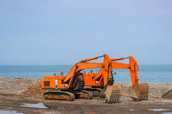 stock image Excavators or diggers on construction site or earthmoving at shore protection works in Batumi. Industry concept