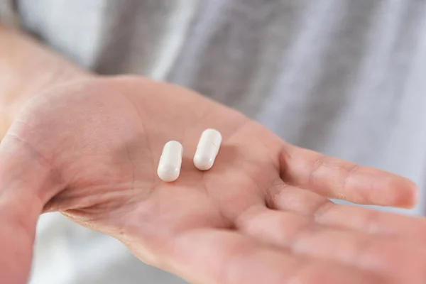 Capsule Bianche Con Collagene Mano Maschile Integratore Alimentare Medicina Farmaco — Foto Stock