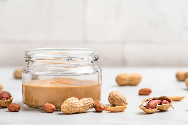 Peanut Butter Jar Heap Nuts White Background Organic Vegan Food — Stock Photo, Image
