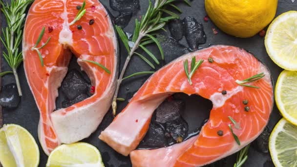 Salmon Steaks Fish Rich Omega Rosemary Lemon Black Slate Board — Stock Video