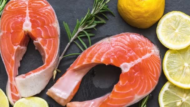 Salmon Steaks Rosemary Lemon Black Slate Board Wooden Table Fish — Stock Video