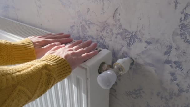 Closeup Man Warming His Hands Yellow Sweater Heater Home Cold — Stock video