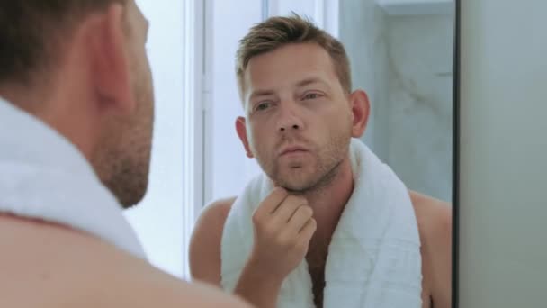 Young Handsome Man Toching His Bristle Face Standing Bathroom Towel Video Clip