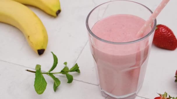 Glass Strawberry Banana Milkshake Straw Table Healthy Refreshment Drink Concept — Stock Video