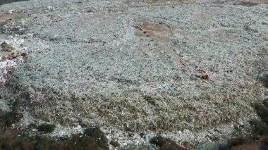 Environmental pollution and ecological disaster. Aerial view of garbage pile in landfill or trash dump. Biohazard for ecosystem and healthy environment concept. View from drone