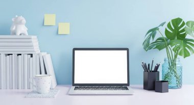 A laptop with a blank screen sits on a desk with books and a plant against a blue wall. Ideal for showcasing websites, apps, and digital content in a workspace.