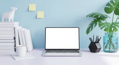 A modern workspace setup featuring a laptop with a blank screen, books, and a plant. Perfect for showcasing designs or presenting information in a clean and professional way.