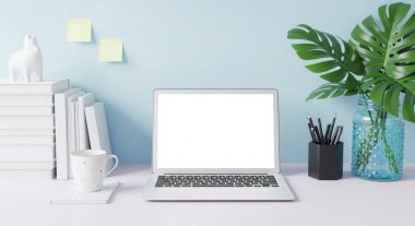 A bright and airy workspace featuring a laptop, books, and a plant on a desk against a blue wall. Perfect for showcasing modern office or home office setups. The scene is clean and minimal.