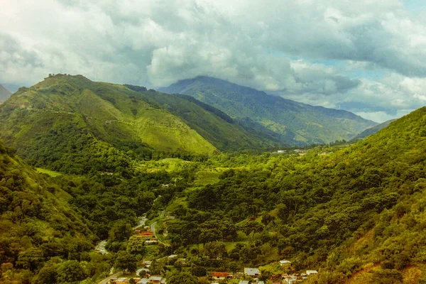 Merida valley village community houses in remote isolated Andes mountains with clouds scenery and green trees landscape - Venezuela - 2002