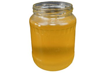 Ballı cam kavanoz. Bir kavanoz bal. Altın bal. Çiğ bal.