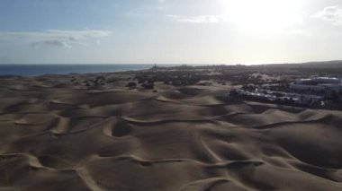 Drone captures stunning Maspalomas dunes in Gran Canaria. Soaring above intricate patterns, offering breathtaking birds-eye views