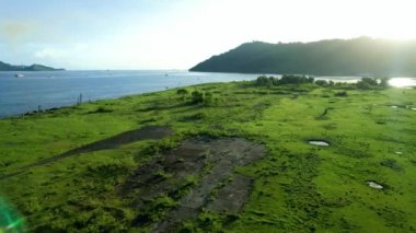Caroline Sahili 'nde hava gün batımı manzarası kur.