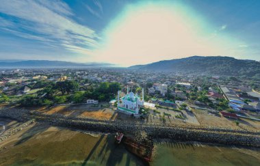 Aerial view at morning of the Al-Hakim Mosque near the coast of Padang City, West Sumatra. clipart