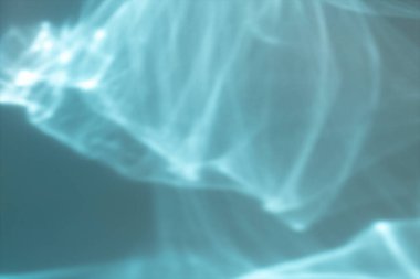 Blurred overlay effect for photo and mockups. Textured blue wall with highlights, water reflection