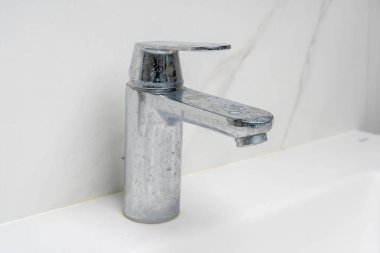 dirty water faucet covered in soap and limescale clipart