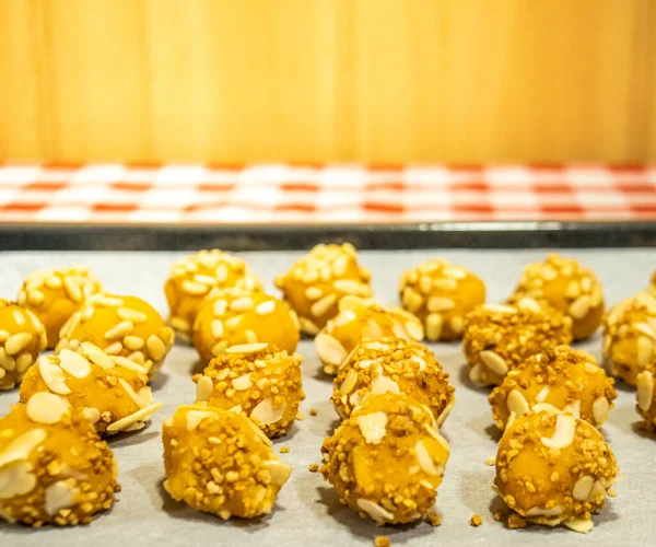 stock image Panellets or cupcakes freshly made and baked at home for traditional parties in a baking tray