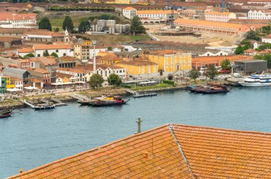 Aerial view of the Douro River and the promenade of Porto with the Rabelas, classic boats for tourist routes of the 6 bridges and the Gaia cable car station on the right. clipart