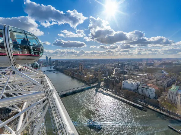 stock image Aerial view of the River Thames, Westminster Abbey and Big Ben from the London Eye with tourists looking at the landscape and taking photos.