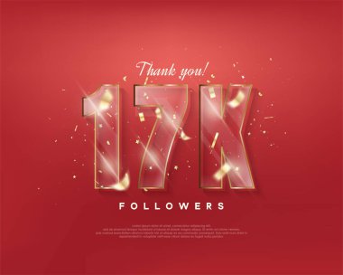 17 bin takipçi kutluyor. Kırmızı arkaplanda cam figürler var..