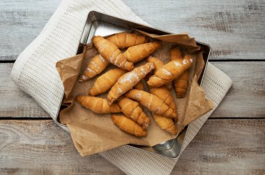 Perfect Croissant Breakfast in the morning. Rustic style. Top view. Mockup. Homemade cakes on a wooden background. Fragrant croissants. Baked goods croissant.