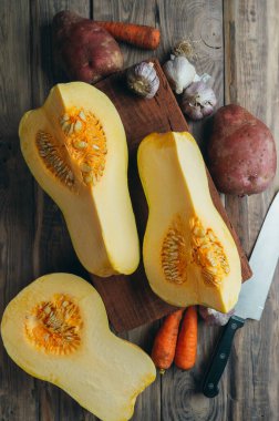 Big red pumpkin background, copy space, Orange  pumpkin , close-up.Pumpkin .Cooking seasonal food from pumpkin. Delicious healthy food. Organic.Autumn.Winter. Vitamins. Diet. Slimming. 