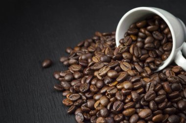Background of roasted coffee beans. Coffee shop concept.Coffee beans, food background and texture from freshly roasted coffee beans, top view banner.