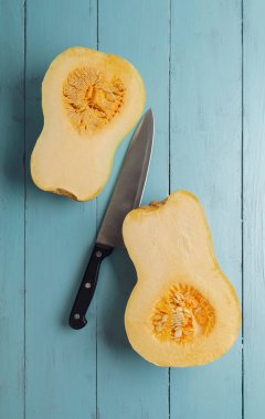 Big red pumpkin background, copy space, Orange  pumpkin , close-up.Pumpkin .Cooking seasonal food from pumpkin. Delicious healthy food. Organic.Autumn.Winter. Vitamins. Diet. Slimming. 