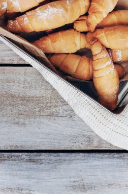 Perfect Croissant Breakfast in the morning. Rustic style. Top view. Mockup. Homemade cakes on a wooden background. Fragrant croissants. Baked goods croissant.